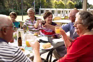 People raising their glasses outside at Renaissance