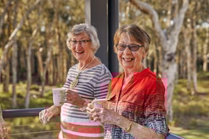Two woman with coffee smiling at Renaissance