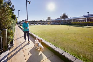 Woman walking two dogs at Renaissance