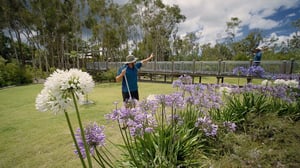 Gardeners waving near bridge-1