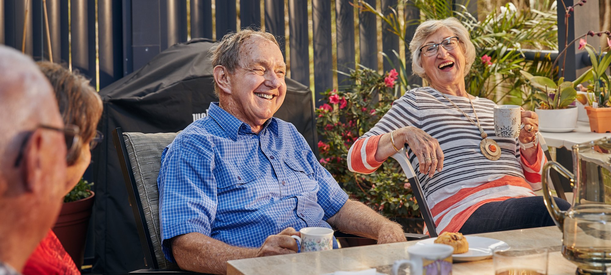 People laughing outside at table Renaissance clipped