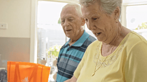 Two people unpacking groceries at Renaissance